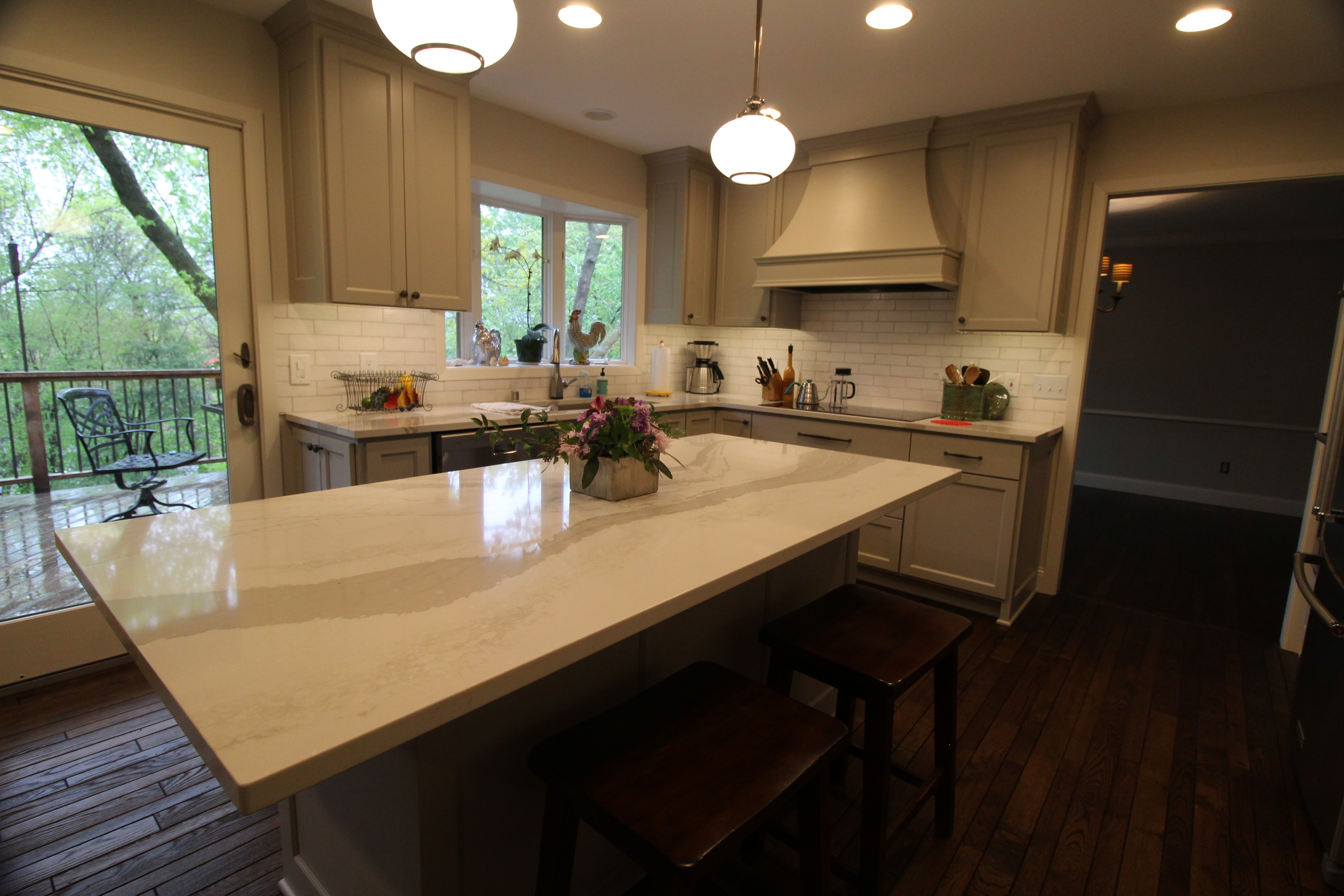 Kitchen looking toward the back door with a view of the deck