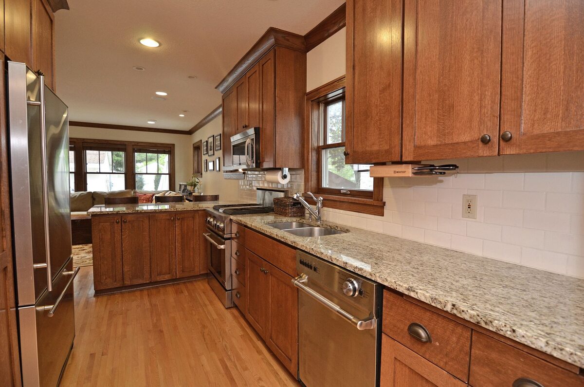 Kitchen renovation with warm wood cabinetry and improved layout
