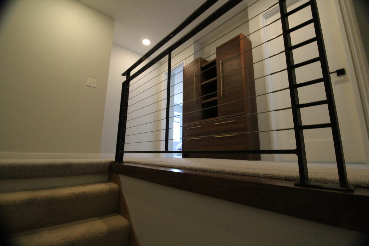 Stair with horizontal cable-rail and a walnut
  </main>
  <footer class=