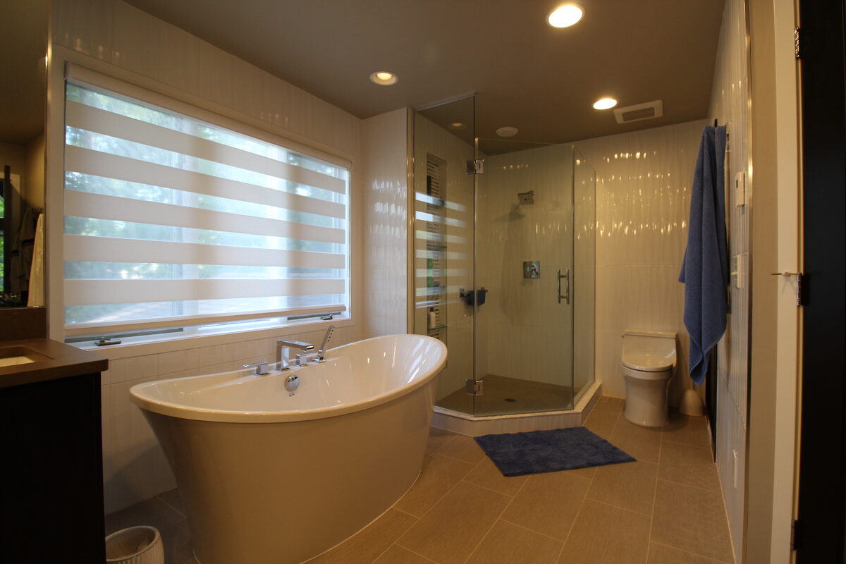 Finished bathroom remodel with tile and vanity detail by Kuechle Construction Company