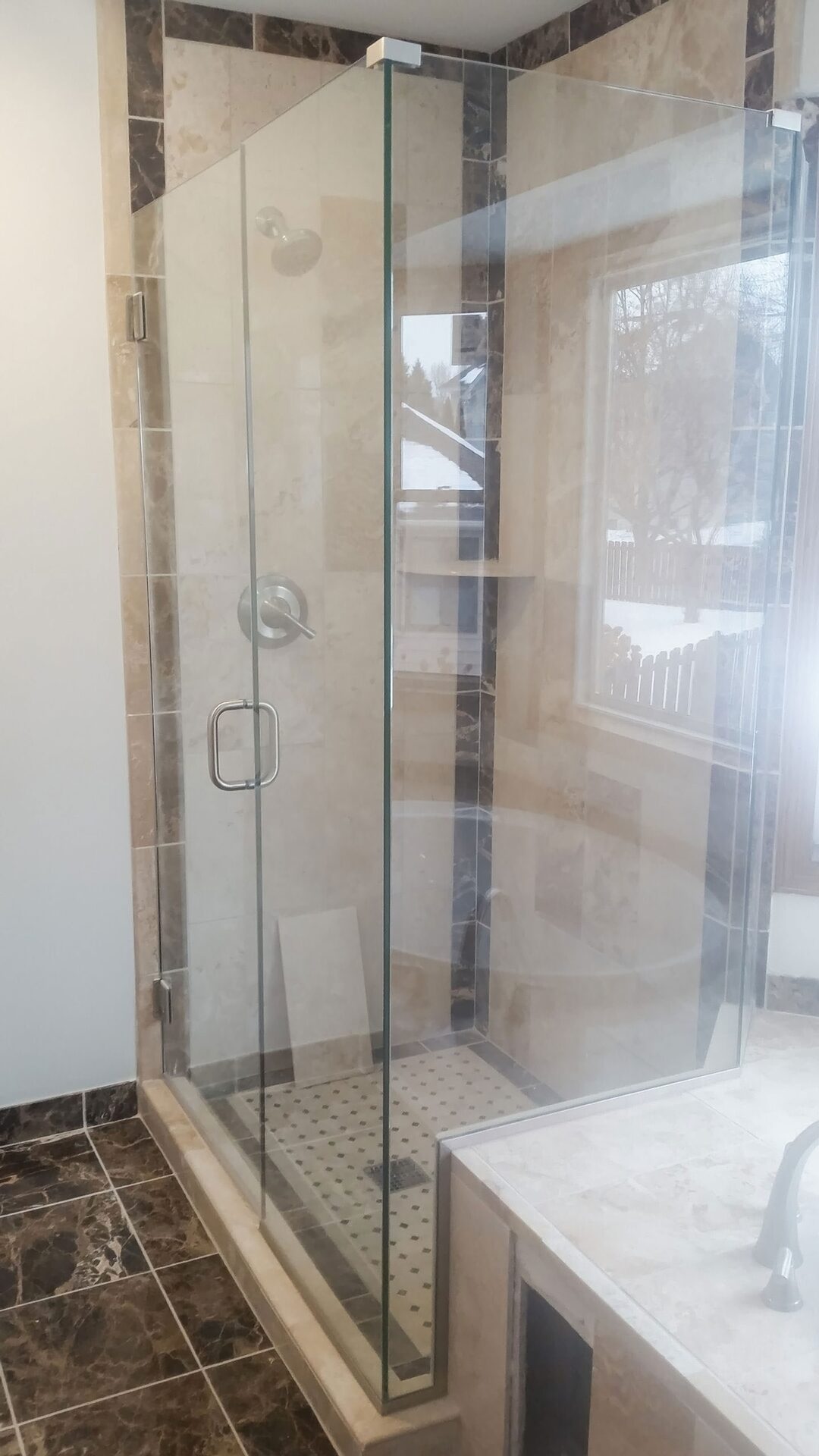 Tile shower detail in a finished bathroom remodel by Kuechle Construction Company