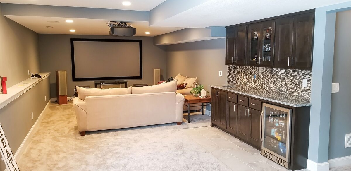 Finished basement family room with fireplace and built-in media wall